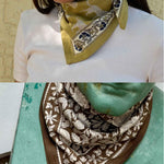 Duo de petits foulards byzantine : Fauve Noix noué au cou et Antioche Kaki noué sur une statue