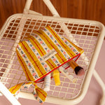 Grande trousse beauté Flora Passion ouverte vue de dessus, pinceaux et soins