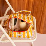 Trousse vanity Flora Passion ouverte vue de dessus, avec une brosse à cheveux